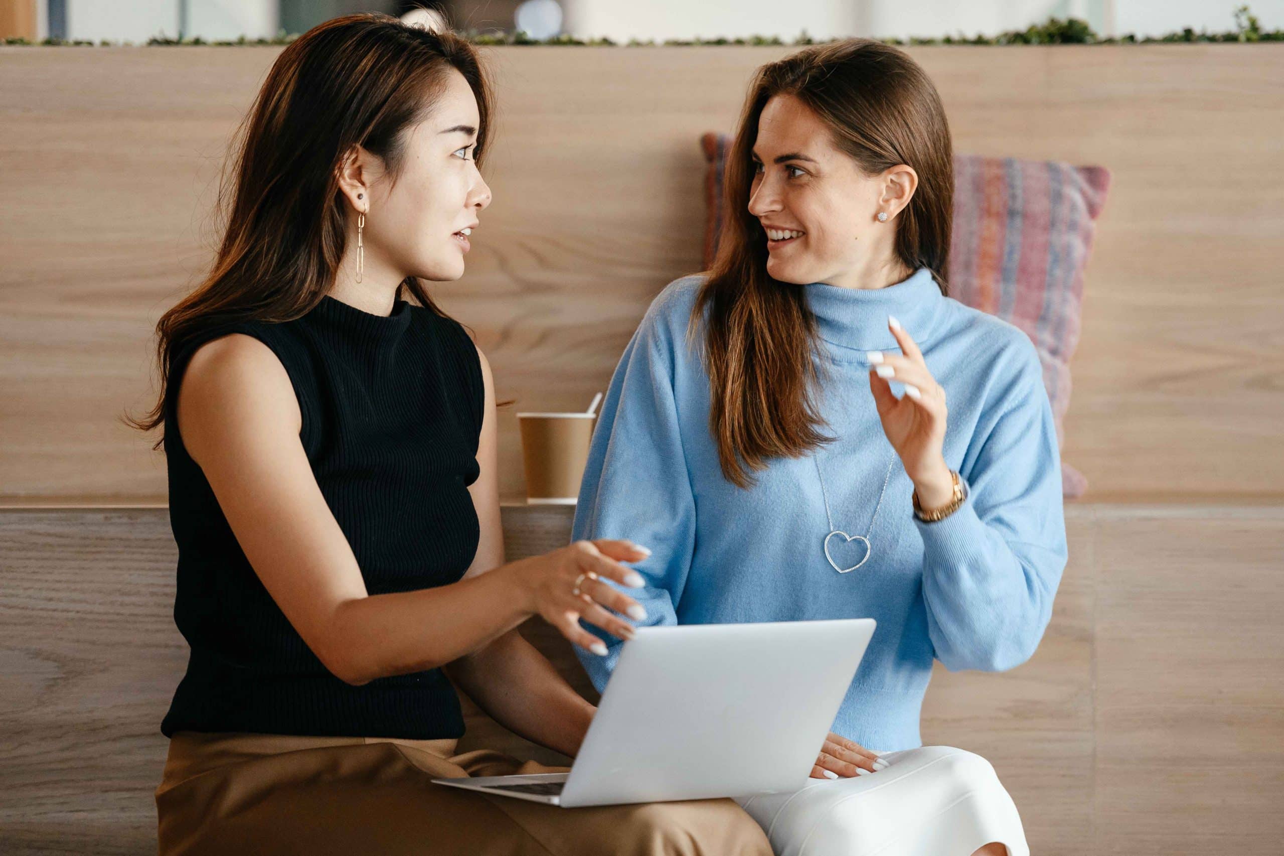 two people smiling talking